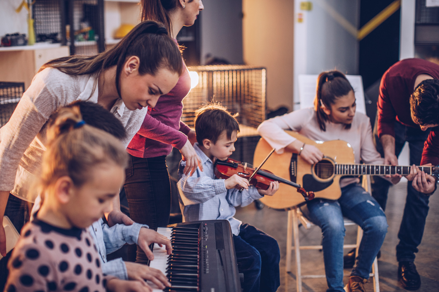 Photo of children being taught music in a school classroom