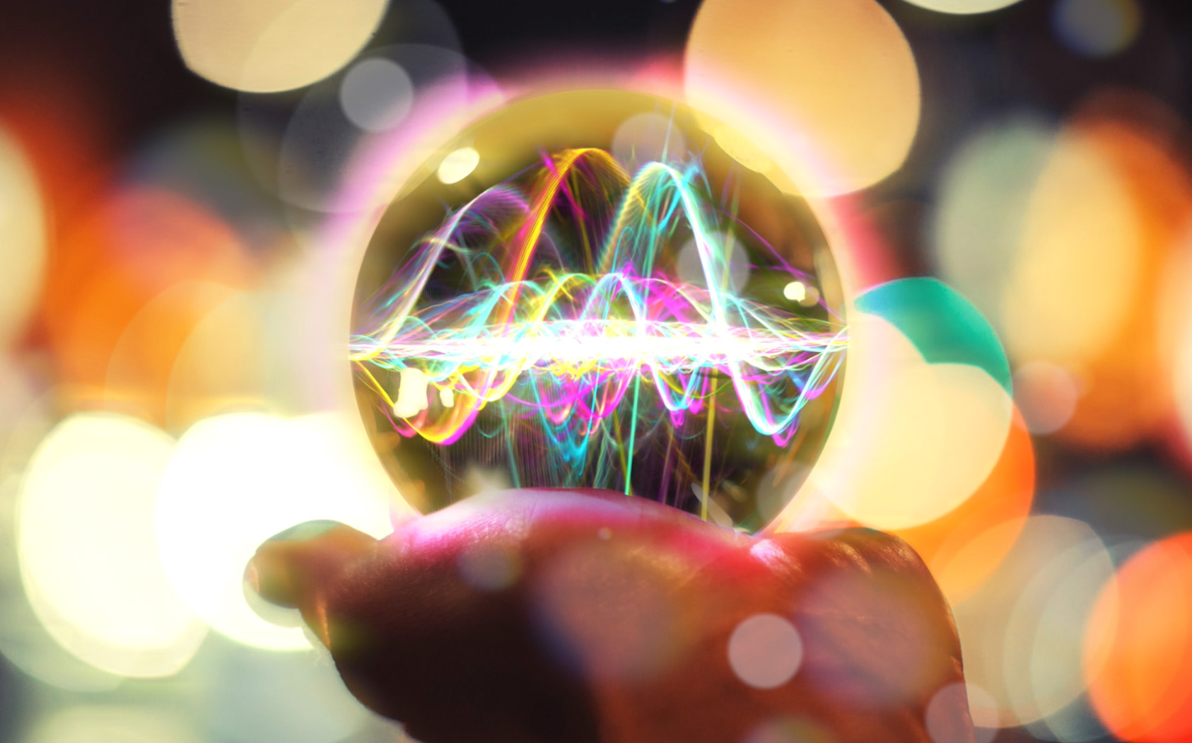 Image of a woman holding a crystal ball with sound waves visible