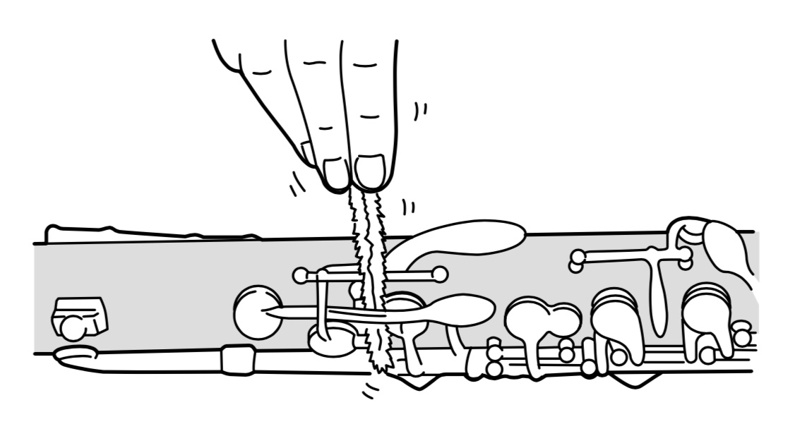 Removing dirt and residue from clarinet tone holes