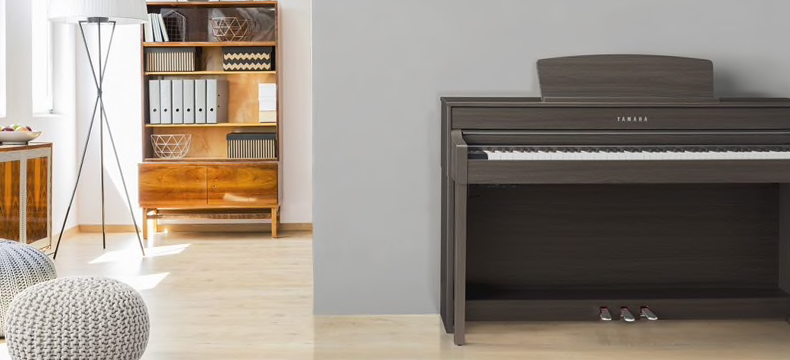 Photo of a young pianist playing the P-125 in their studio room
