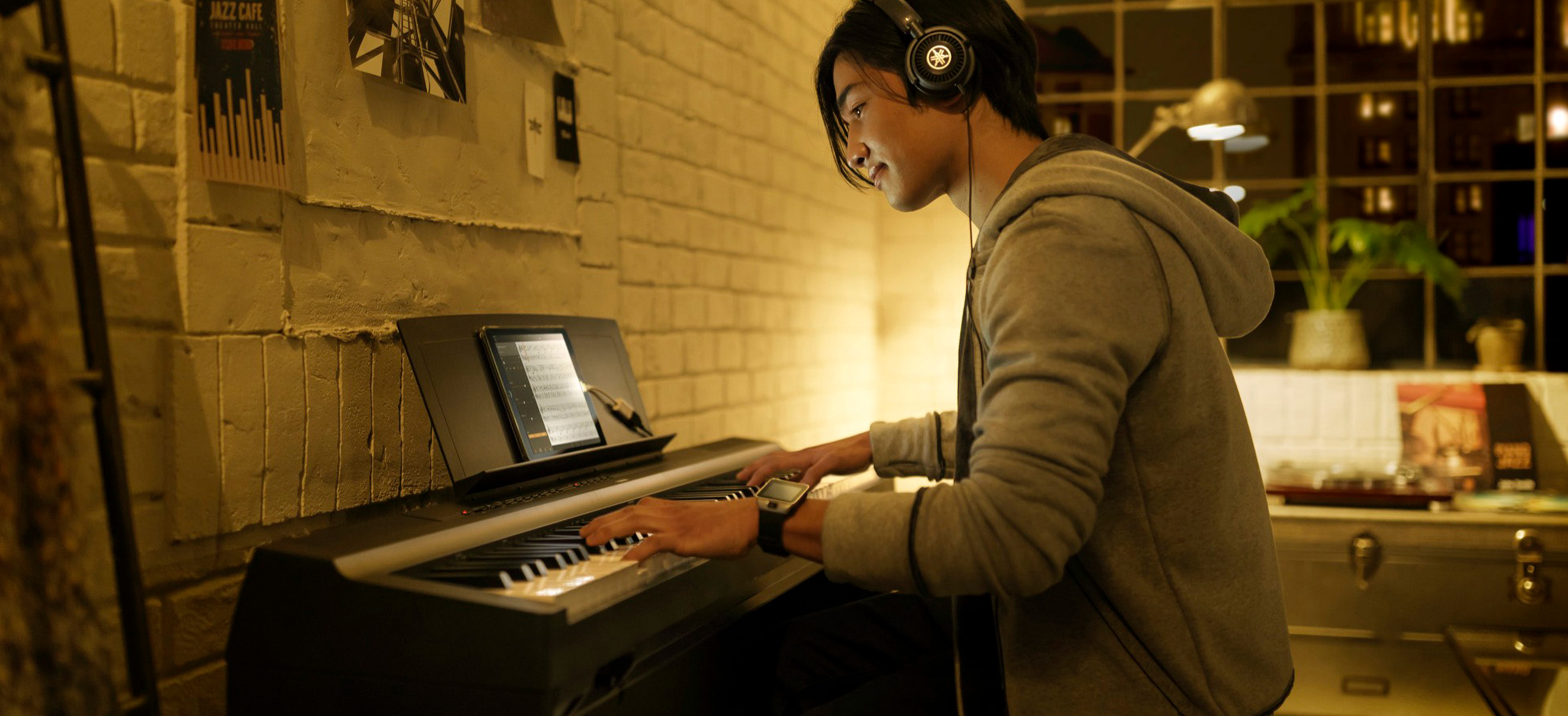 Photo of a young pianist playing the P-125 in their studio room