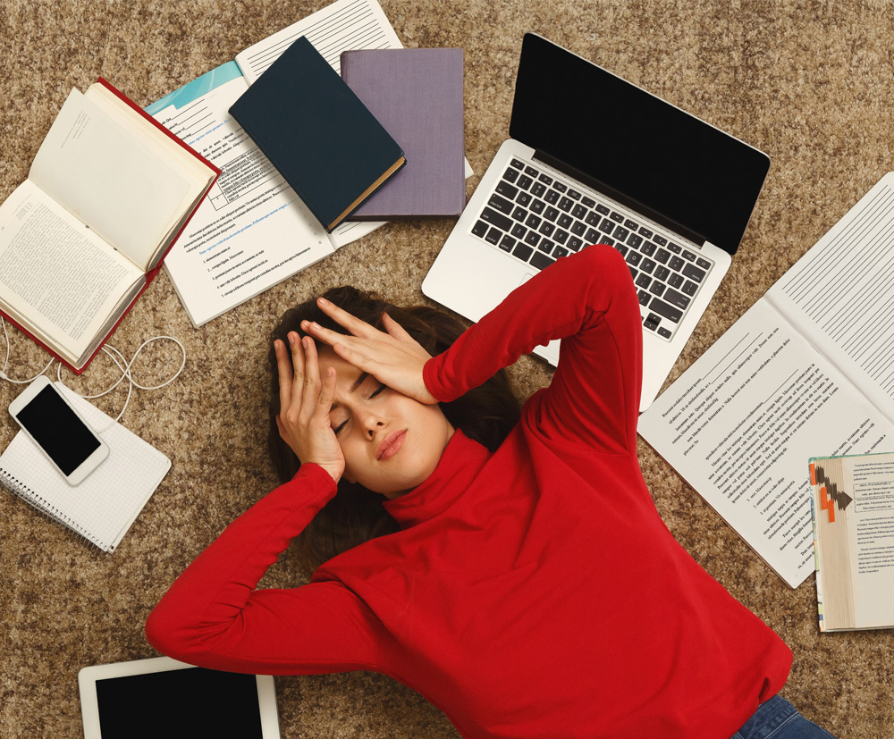 Teenage girl overwhelmed by academic and social demands