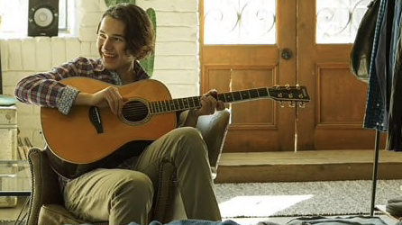 Child learning to play guitar