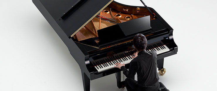 Pianist playing a Yamaha CF Series Concert Grand Piano