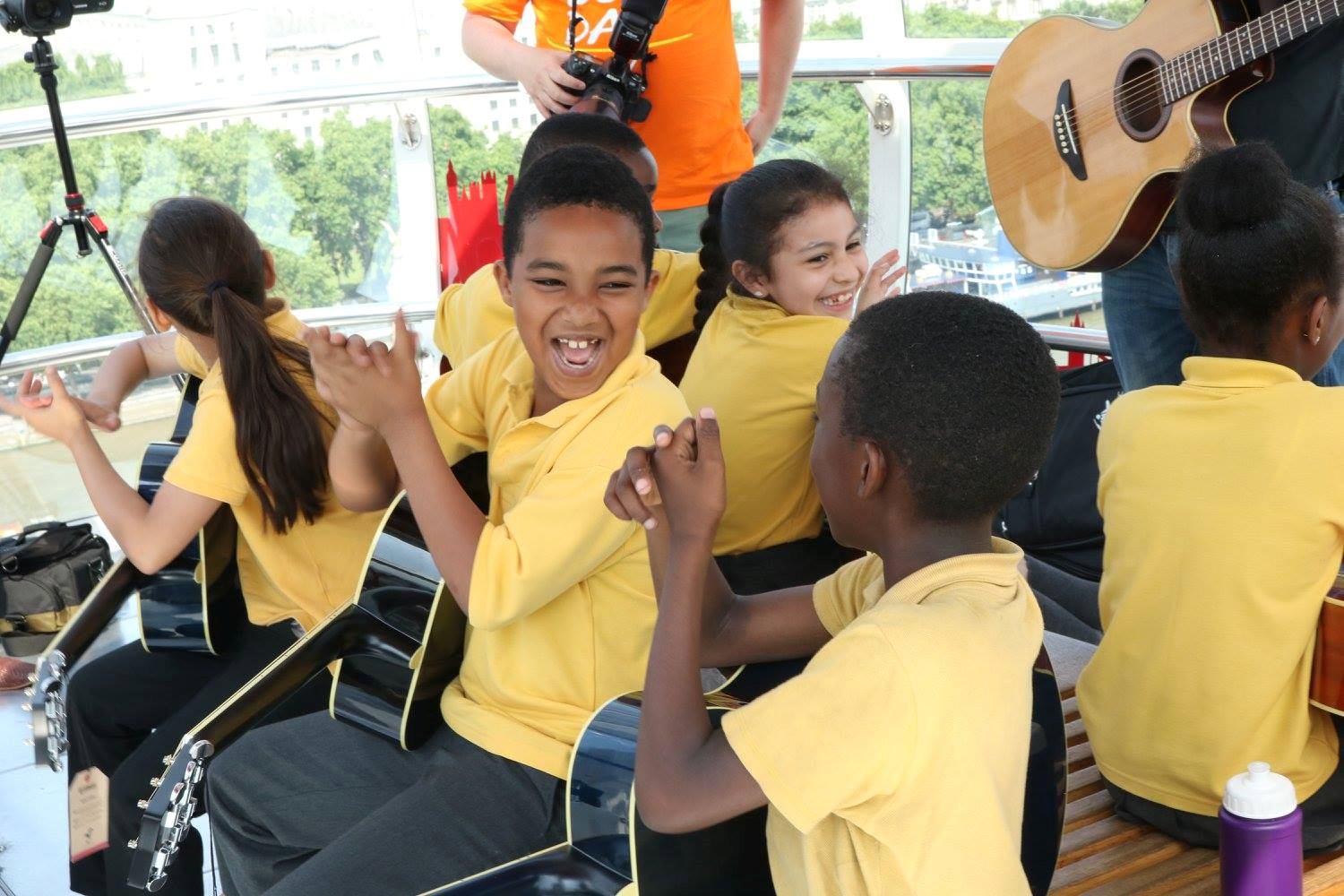 Yamaha Music London holds a guitar lesson on the London Eye with pupils from St George's Cathedral Catholic Primary School