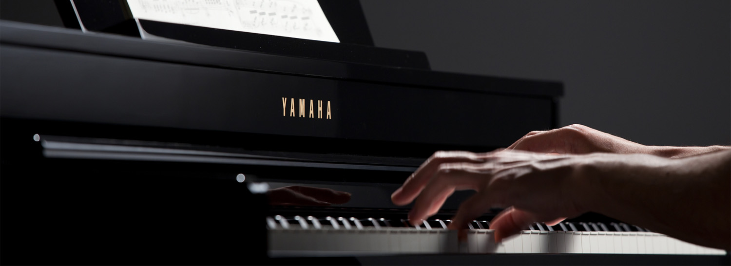 Photo of a pianist playing a Clavinova